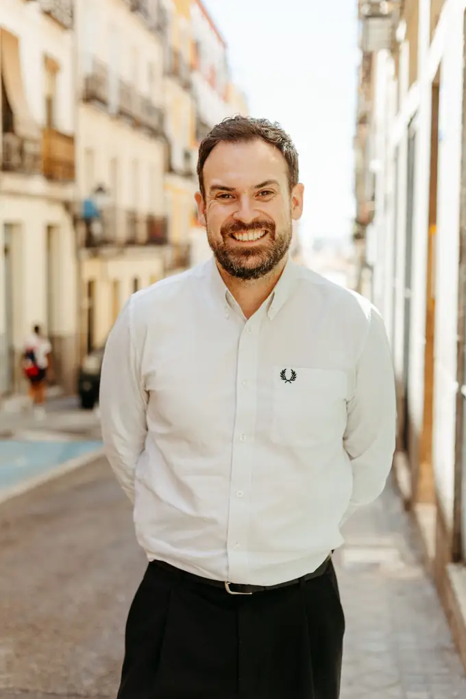 Adam Day standing on a sunny street